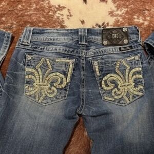 Miss Me Classic Blue Bootcut Women's Jeans With Fleur De Lis On Pockets.